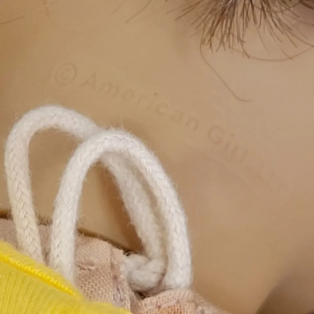 American Girl Doll Grey eyes light brown hair.
